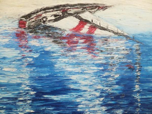Vela ribaltata a riva